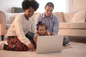 Family playing game virtually with grandparent