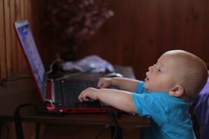 Baby talking with grandparent on the computer