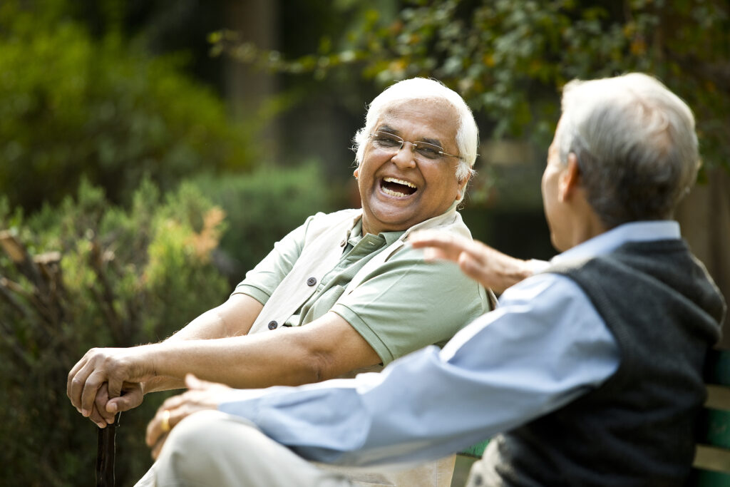 seniors laughing in park elderly outside